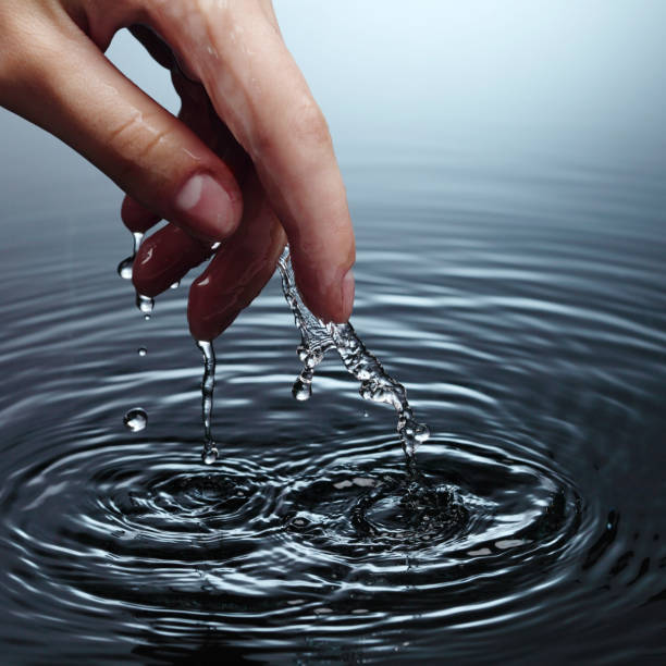 istock woman hand in water 1913866739