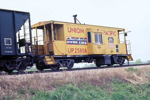 Union Pacific bay window caboose. Built in 1923 as an Oregon Short Line wooden caboose with steel underframe. Photographed in 1983 just as cabooses were being eliminated from trains in the United States.