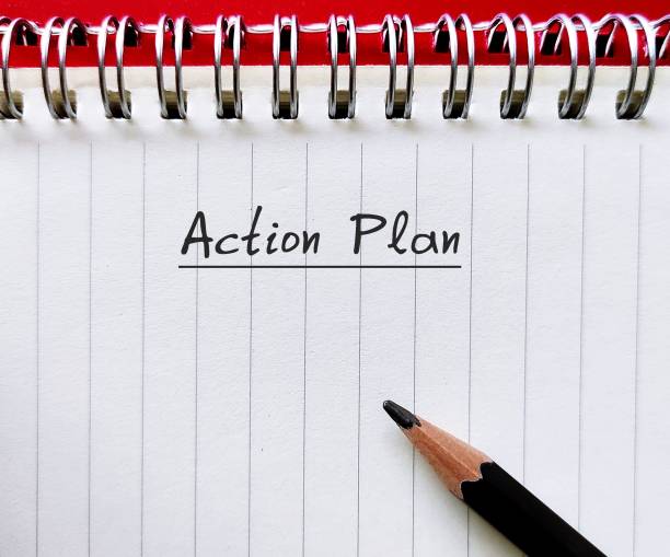istock On red background, notebook with pencil writing ACTION PLAN, to write proposed strategy or course of action,  lists what steps must be taken in order to achieve specific goal 1913920746