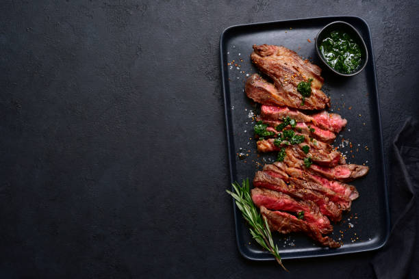 istock Grilled marbled beef steak. Top view with copy space. 1913978238