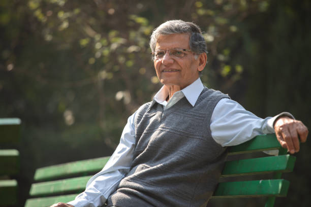 istock Thoughtful elderly man sitting on park bench 1913981846