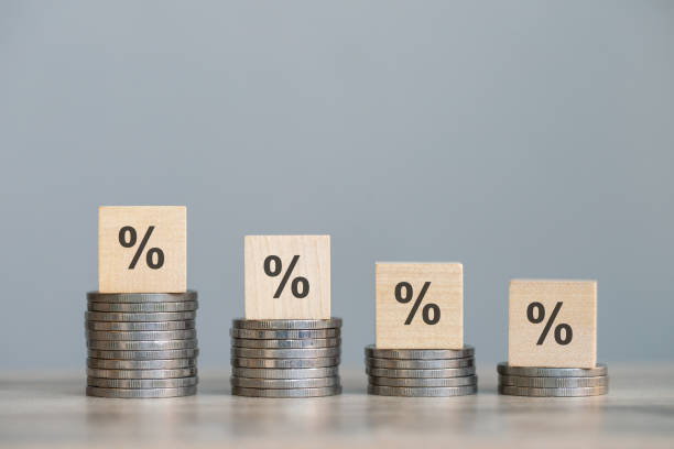 istock wood cube block with return on investment in stocks, crypto coins, grows according to target 1914043252