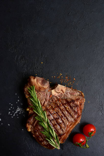 istock Grilled T-bone beef steak. Top view with copy space. 1914051567