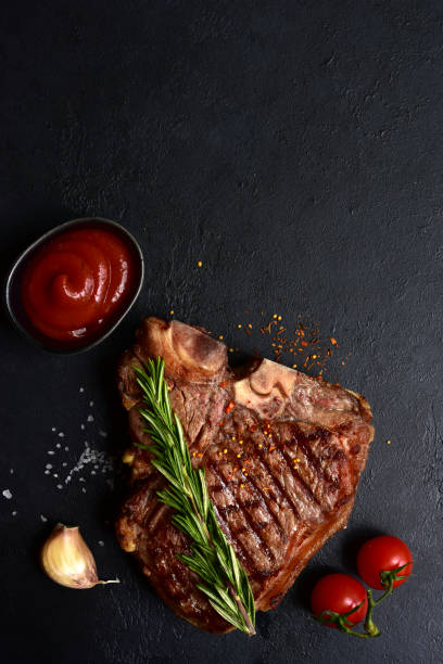 istock Grilled T-bone beef steak. Top view with copy space. 1914051573