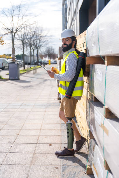 istock Engineer with prosthetic leg working in a construction site outdoors 1914056244