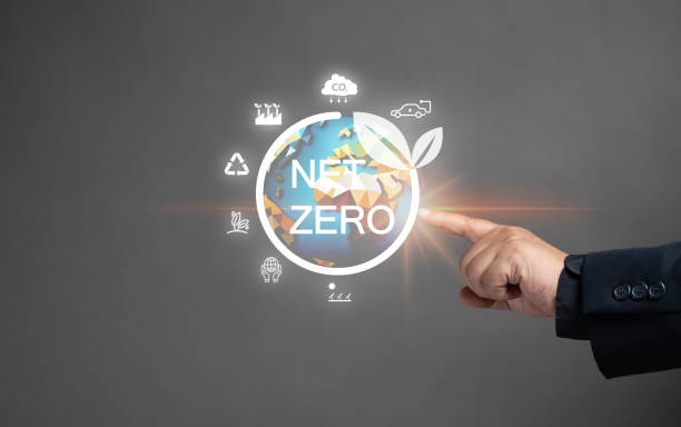 istock net zero emissions and Carbon neutrality concept. sustainable and clean tech. global warming. Environmental protection, climate eco energy. Man point the net zero globe icon on virtual screen. 1914120009