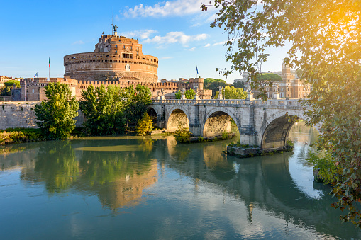Rome, Italy - October 2022: Castle of Holy Angel (Castel Sant'Angelo) and St. Angel bridge (Ponte Sant'Angelo) over Tiber river in Rome