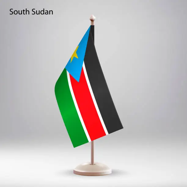 Vector illustration of Flag of South Sudan hanging on a flag stand.