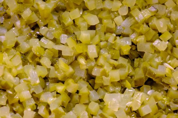 istock Cut a large amount of pickled cucumber into small cubes 1914136765