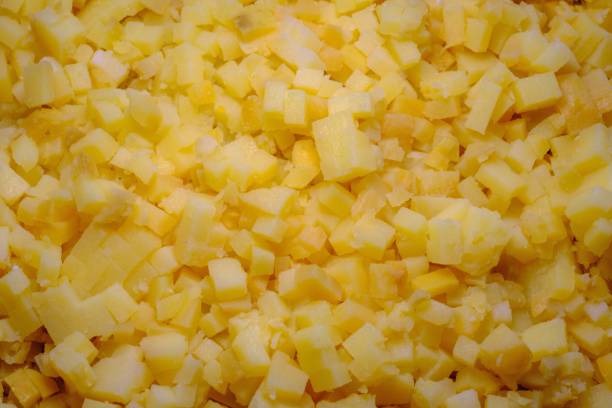 istock Boiled potatoes cut into small cubes. Making salads in large quantities 1914136780