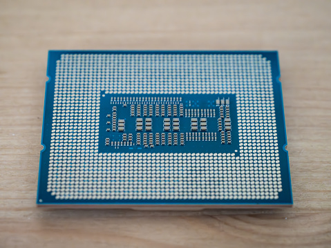 Closeup shot of a central processing unit CPU isolated on white, microchip semiconductor technology, silicon