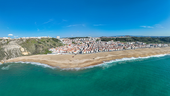 Nazare Town in Portugal. Beach and Cityscape. Drone Point of view.