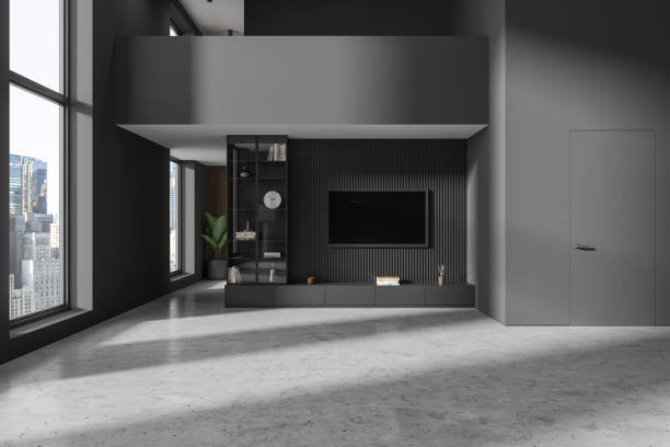 istock Grey modern home living room interior with tv screen, shelf and panoramic window 1914220477