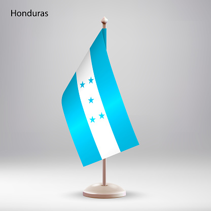 Flag of Honduras hanging on a flag stand. Usable for summit or conference presentaiton