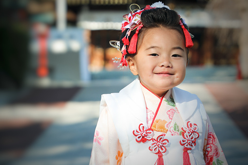 Nihongami.\nShichigosan which is A 3-year-old Japanese girl has life events to pray for her health wearing a kimono.