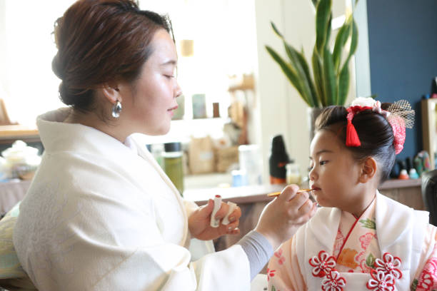 istock Asian mother make up her daughter face 1914230783
