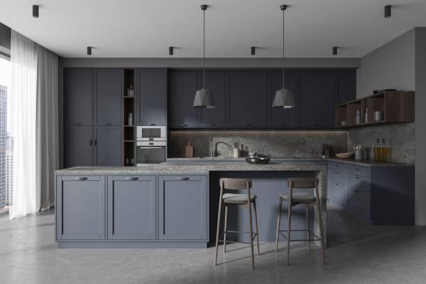 istock Traditional home kitchen interior bar counter and cabinet, panoramic window 1914236925