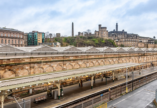 Edinburgh Waverley train station platform with city beyond