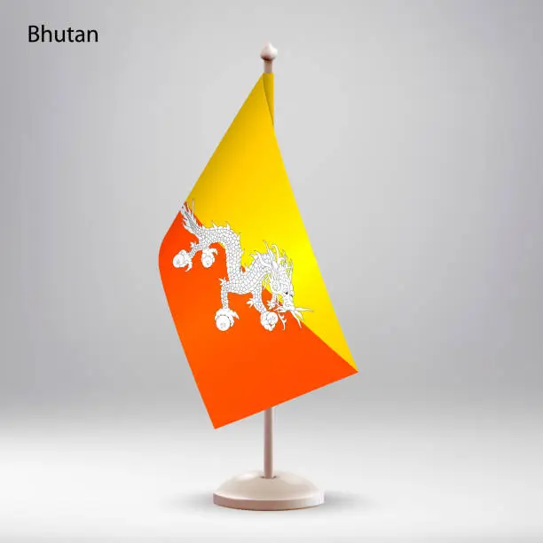 Vector illustration of Flag of Bhutan hanging on a flag stand.