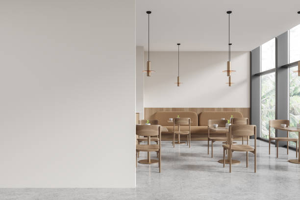 istock Modern cafe interior with dining table and chairs, window. Mock up wall 1914242201