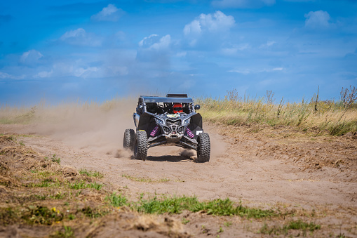 UTV buggy offroad vehicle racing on sand. Extreme and adrenalin. 4x4.