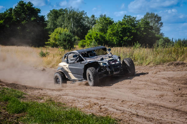 istock ATV and UTV riding in sandy dusty track. Amateur competitions. 4x4. 1914252608