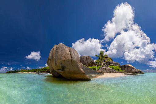 Famous view at beautifully shaped granite boulders and a perfect white sand at the famous Anse Source d'Argent beach, La Digue island, Seychelles