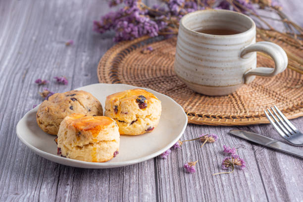 istock Traditional British scones and cookie with a tea cup and blurred background 1914260498
