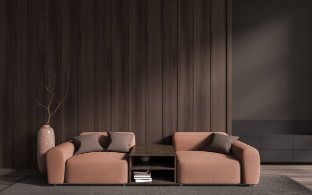 istock Brown home living room interior with couch and coffee table, empty wall 1914274299