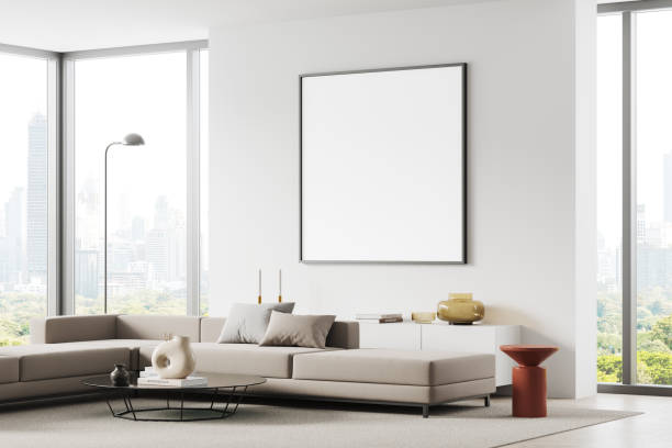 istock Stylish home chill room interior couch and sideboard near window, mockup frame 1914276375