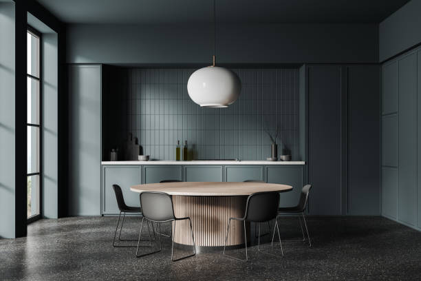 istock Dark blue home kitchen interior with cooking and eating zone, panoramic window 1914280495