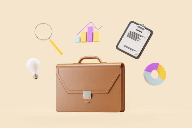 istock Briefcase and office supplies over beige 1914281009