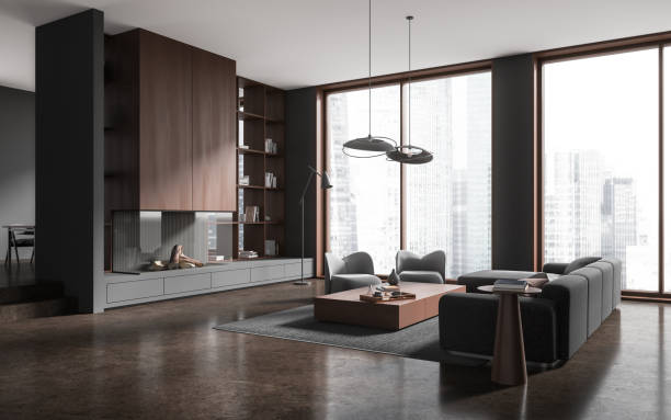 istock Dark home living room interior with relax zone, fireplace near panoramic window 1914283625