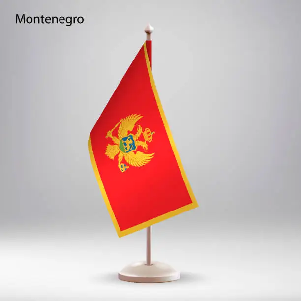 Vector illustration of Flag of Montenegro hanging on a flag stand.