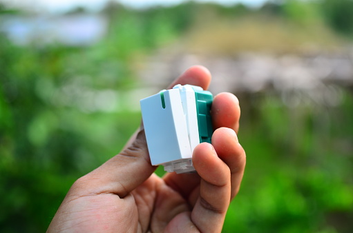 Man holding technology of recycled plastic pellets. Scientists and Polymer Products Love World. recycled polymer graphics. Environmental business.