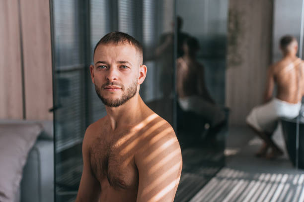 Serene man, bare-chested, with shadow stripes, mirror reflection of contemplative pose