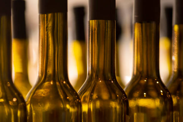 istock Olive oil bottles in mass production during filling 1914331049