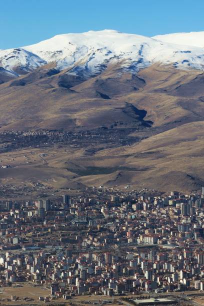 istock Stratovolcano and city 1914376197