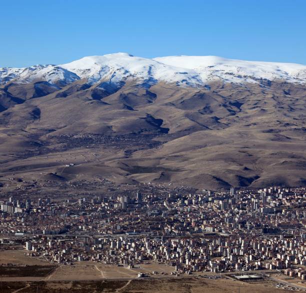 istock Stratovolcano and city 1914384684