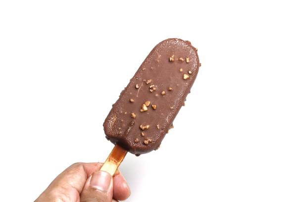 istock hand holding chocolate ice cream isolated over white background 1914395539