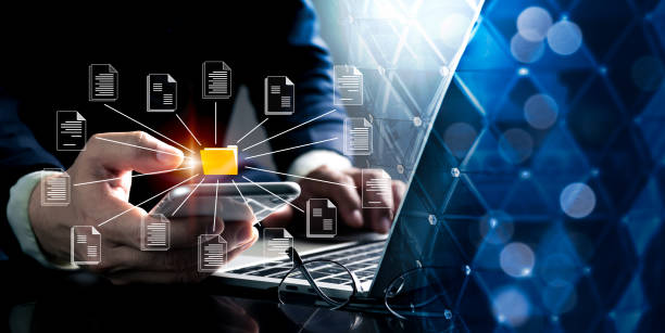 A businessman clutching a folder and a document symbol represents the conceptualization of a document management system. utilizing an online document database to search and manage files. A businessman clutching a folder and a document symbol represents the conceptualization of a document management system. utilizing an online document database to search and manage files. process automation office stock pictures, royalty-free photos & images