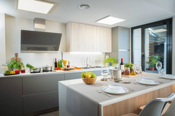 istock Modern kitchen interior with island ready for eating in 1914458714