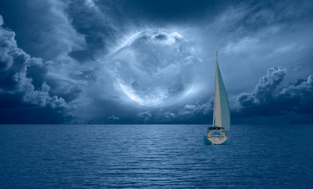 istock Lone yacht with Super Full Moon 1914479924