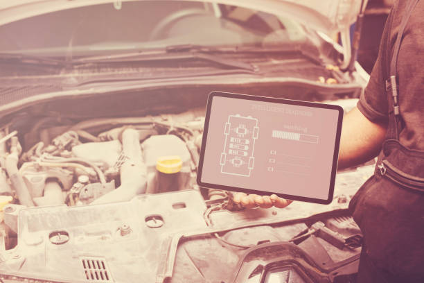 istock Mechanic using tablet checking up on car engines parts for fixing and repair 1914527495
