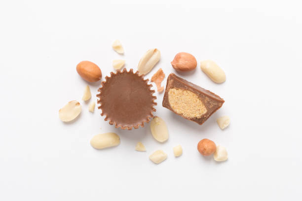 istock Tasty chocolate peanut butter cups on color background, top view 1914535899
