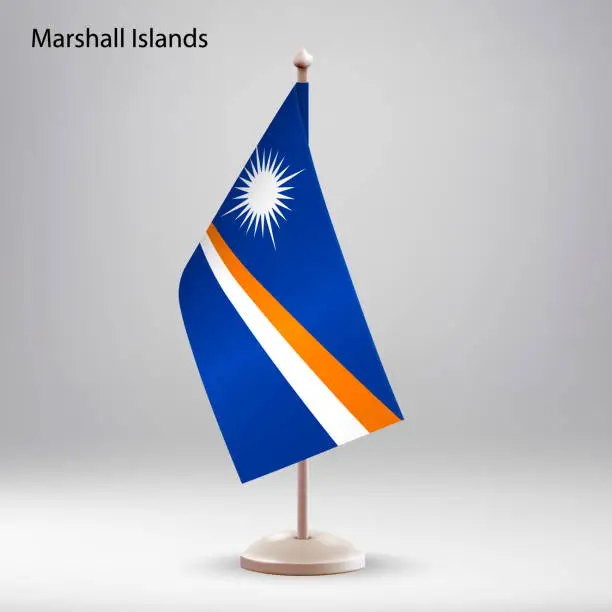 Vector illustration of Flag of Marshall Islands hanging on a flag stand.