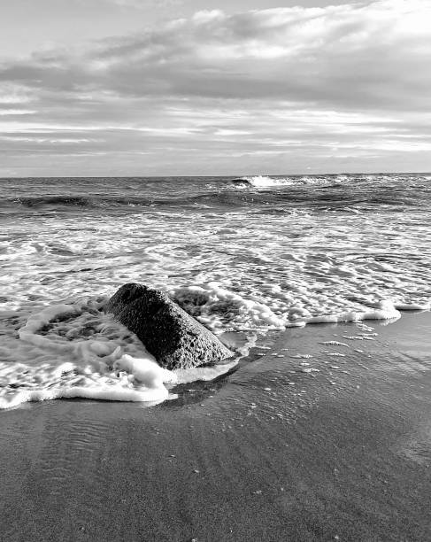 istock Waves and sea foam at Whitley Bay beach 1914547655