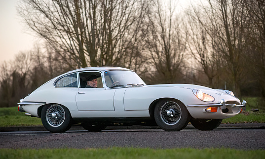 Stony Stratford,UK Jan 1st 2024. 1971 white e type Jaguar car arriving at Stony Stratford for the annual New Years Day vintage and classic vehicle festival.