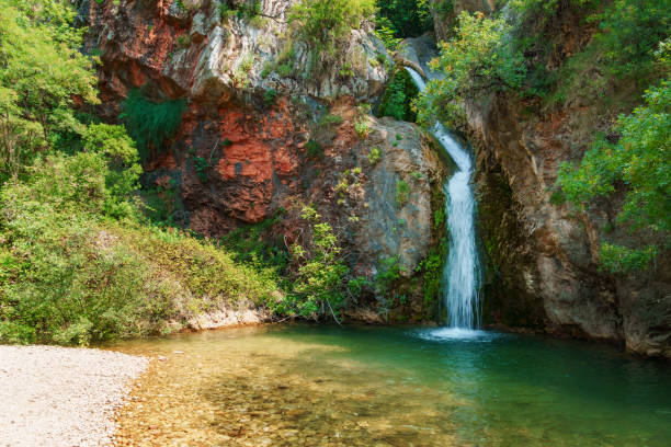 istock waterfall in the mountains, beautiful summer bright landscape 1914563576