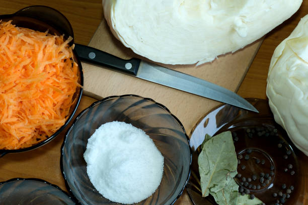 Slicing white cabbage on the table for homemade pickling and sourdough, close-up, macro photography